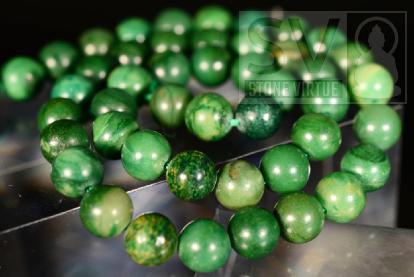 8mm natural Jade bead, revered for its protective and healing properties, promoting harmony, prosperity, and emotional balance.