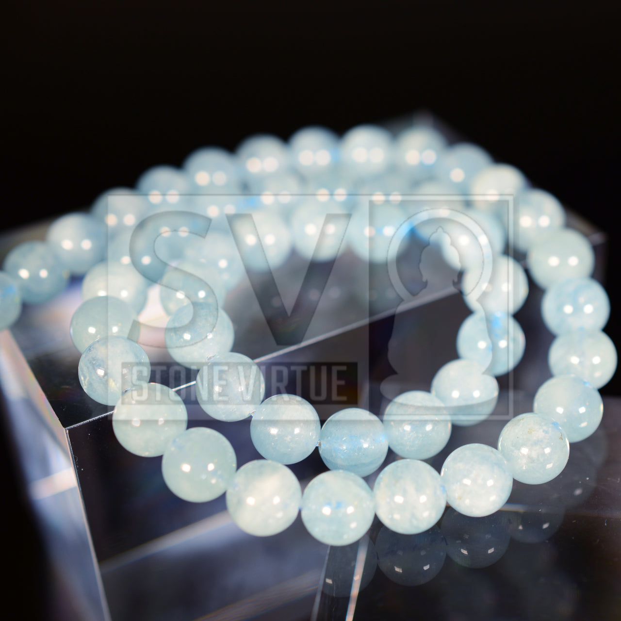 strand of 8mm natural Aquamarine beads, known for calming energies, enhancing clarity, courage, and aiding in self-expression.