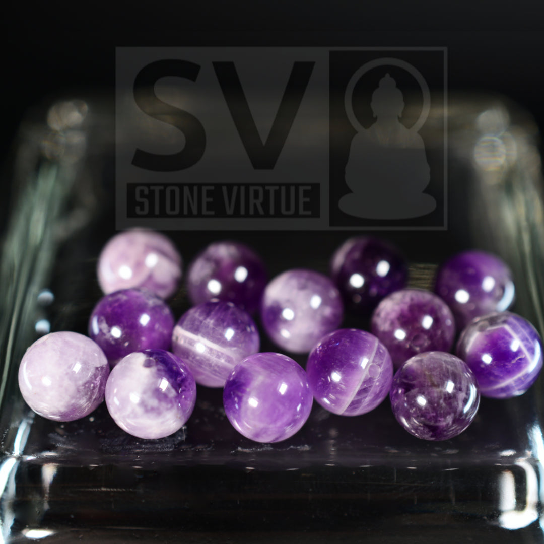 8mm natural Amethyst bead, known for its spiritual healing properties, promoting tranquility, clarity, and protection from negative energy.