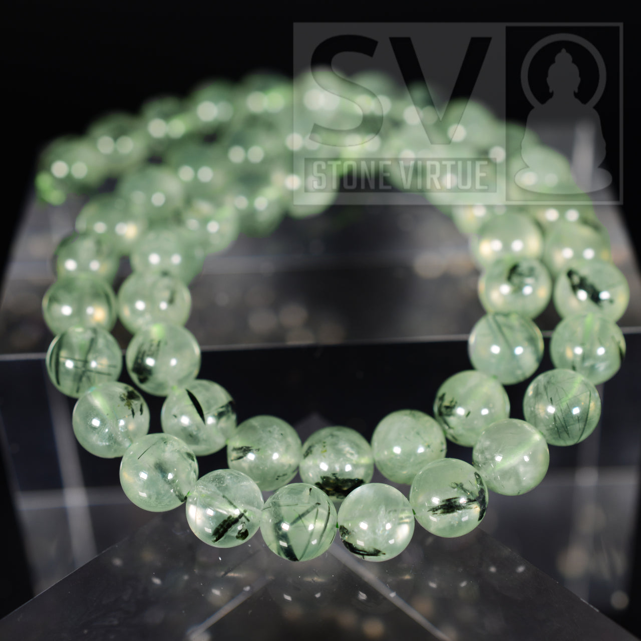 8mm natural Prehnite bead, associated with unconditional love, spiritual growth, and connecting to one’s inner peace and intuition.
